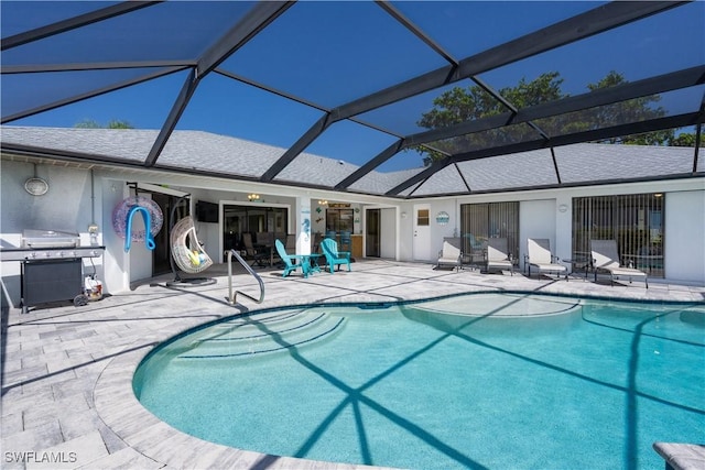 view of swimming pool with a grill, a lanai, and a patio