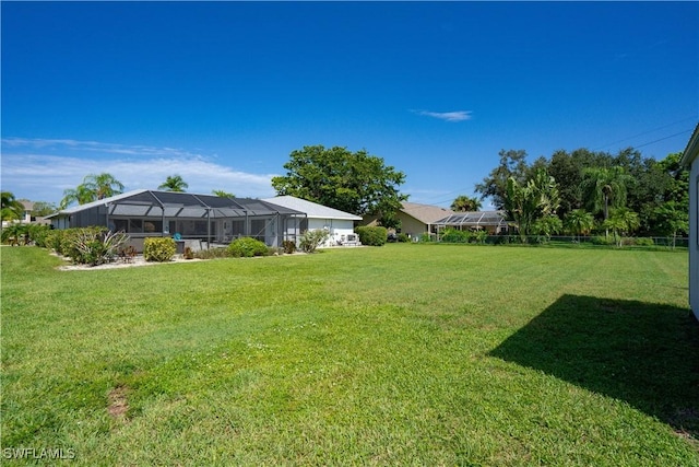 view of yard with a lanai