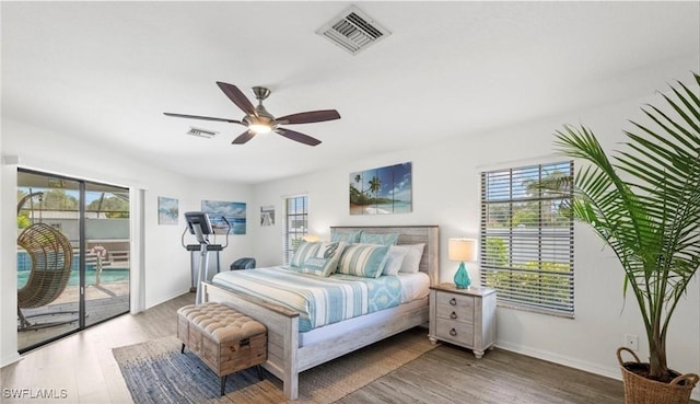 bedroom featuring access to exterior, ceiling fan, and hardwood / wood-style flooring