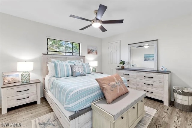 bedroom with light hardwood / wood-style flooring and ceiling fan