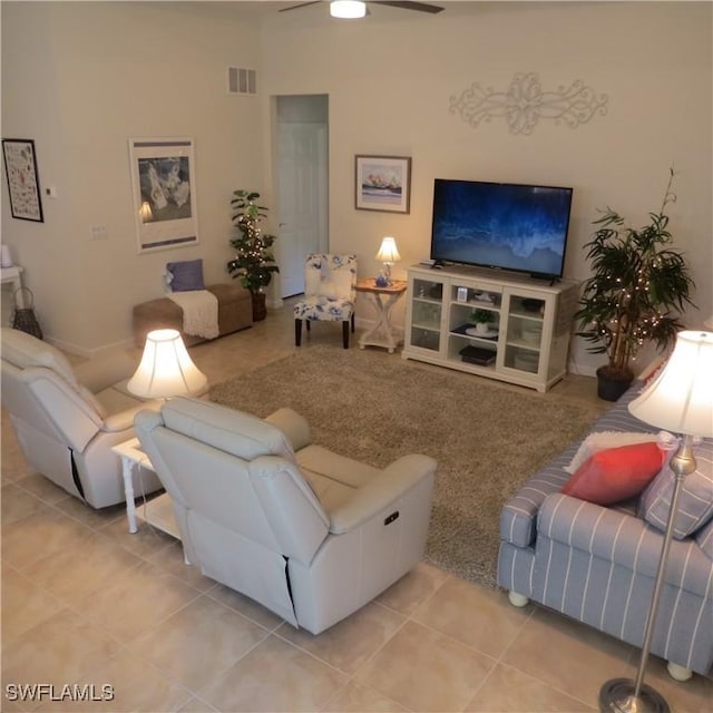 tiled living room featuring ceiling fan