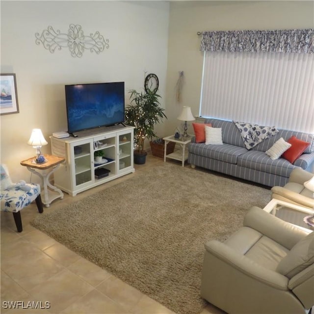 living room with tile patterned floors