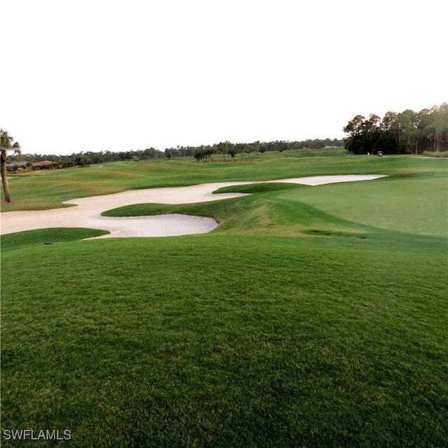 8874 Horned Lark Dr, Naples, FL 34120 - surrounding community featuring golf course view and a lawn