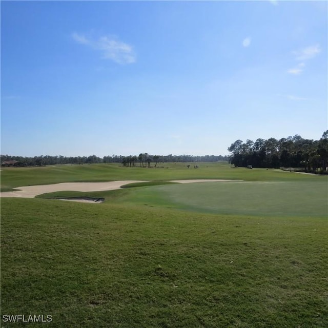 8874 Horned Lark Dr, Naples, FL 34120 - view of home's community featuring golf course view and a yard