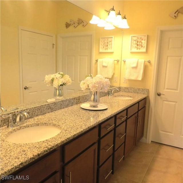 8874 Horned Lark Dr, Naples, FL 34120 - bathroom with double vanity, a sink, and tile patterned floors