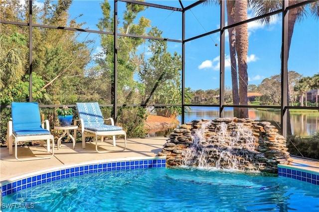 view of pool featuring a patio, a water view, pool water feature, and a lanai