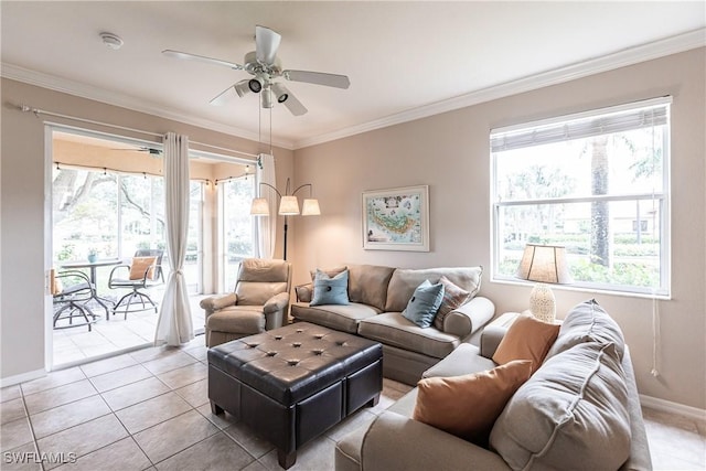 tiled living room with ceiling fan and crown molding