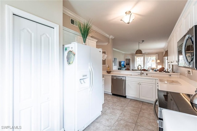 kitchen with decorative light fixtures, kitchen peninsula, sink, white cabinetry, and stainless steel appliances