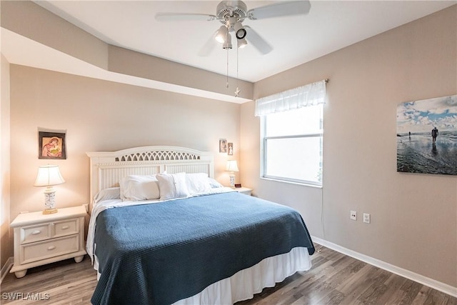 bedroom with ceiling fan and hardwood / wood-style flooring