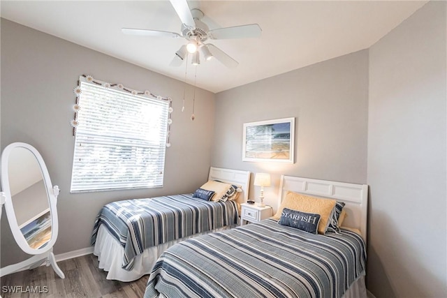 bedroom with hardwood / wood-style flooring and ceiling fan