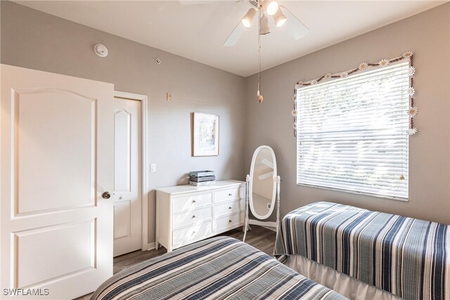 bedroom with hardwood / wood-style flooring and ceiling fan