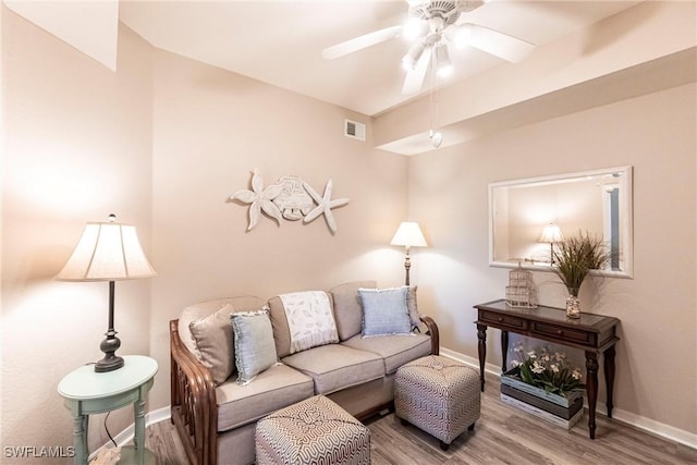 living room with hardwood / wood-style floors and ceiling fan