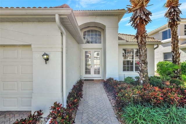 entrance to property featuring a garage