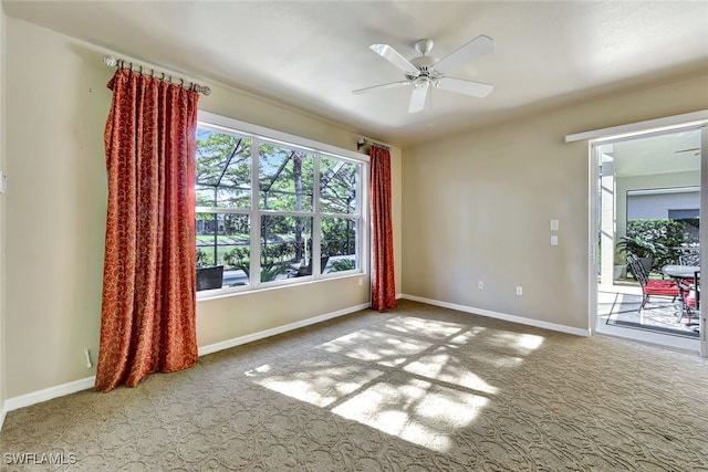 empty room featuring carpet and ceiling fan