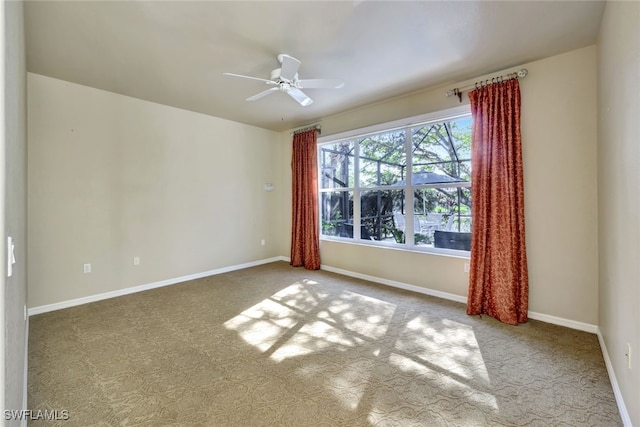 spare room with ceiling fan