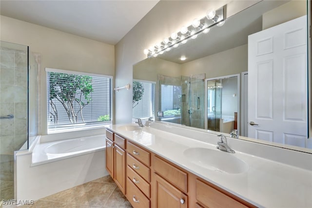 bathroom featuring vanity, independent shower and bath, and tile patterned flooring