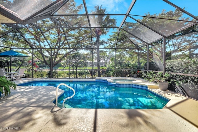 view of pool featuring an in ground hot tub, glass enclosure, and a patio