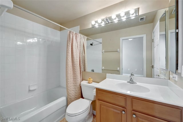 full bathroom with shower / tub combo with curtain, vanity, and toilet