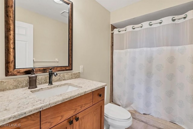 bathroom with vanity and toilet