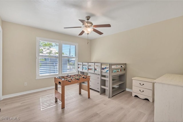 bedroom featuring ceiling fan and light hardwood / wood-style flooring