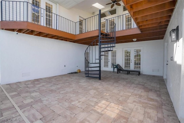 view of patio / terrace featuring ceiling fan and french doors