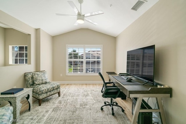 office space with hardwood / wood-style flooring, vaulted ceiling, and ceiling fan