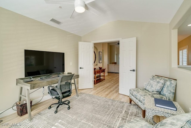 office featuring ceiling fan, lofted ceiling, and light hardwood / wood-style flooring