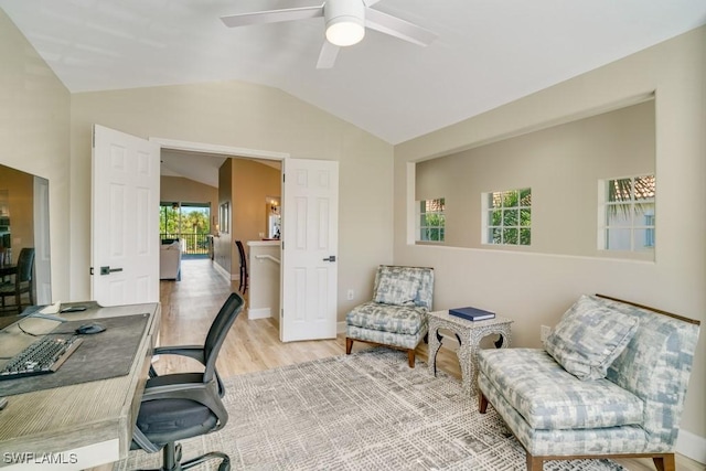 office with light wood-type flooring, vaulted ceiling, and ceiling fan