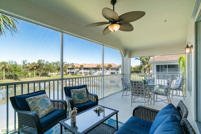 sunroom / solarium featuring ceiling fan and lofted ceiling