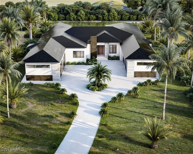 view of front of property featuring stucco siding and a front yard