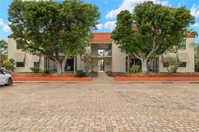 view of front of property with a balcony