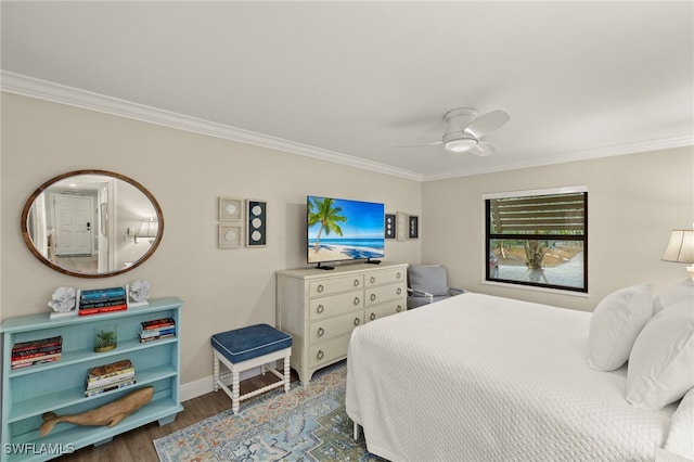 bedroom featuring ceiling fan, hardwood / wood-style flooring, and crown molding