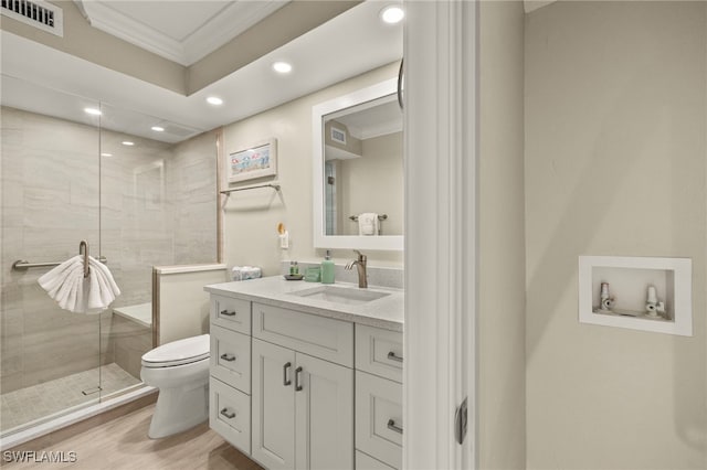 bathroom with a shower with shower door, wood-type flooring, toilet, and ornamental molding