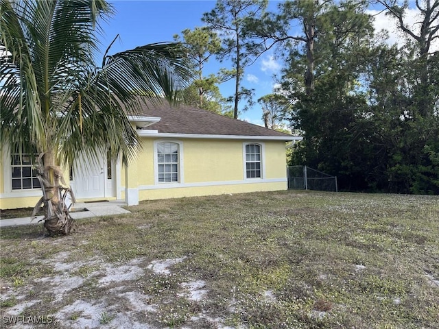 view of home's exterior with a yard