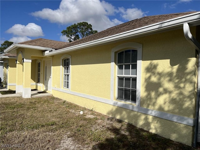 view of home's exterior with a yard