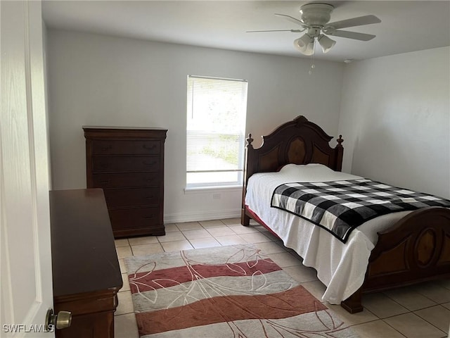 bedroom with light tile patterned flooring and ceiling fan