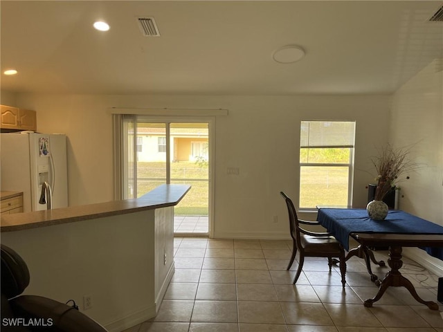 dining space with light tile patterned flooring