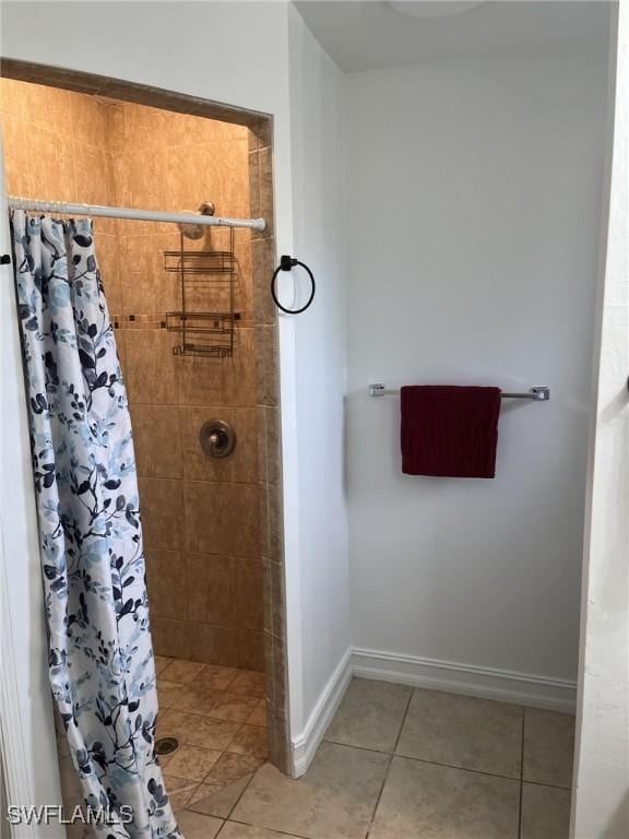 bathroom featuring tile patterned floors and a shower with curtain