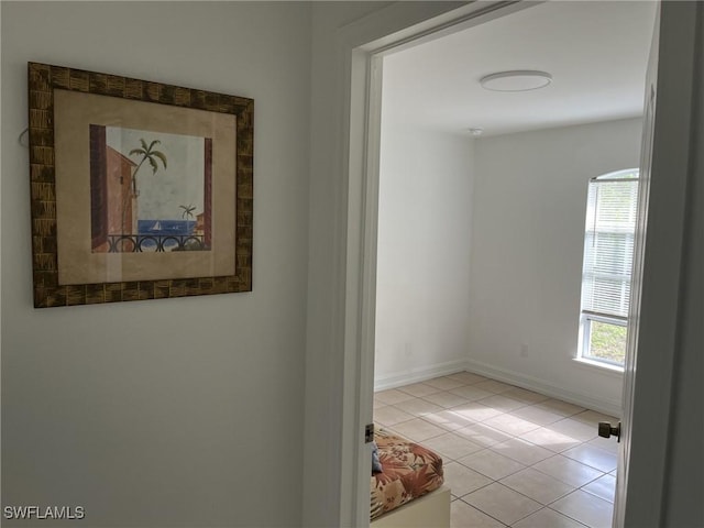 hallway featuring light tile patterned floors