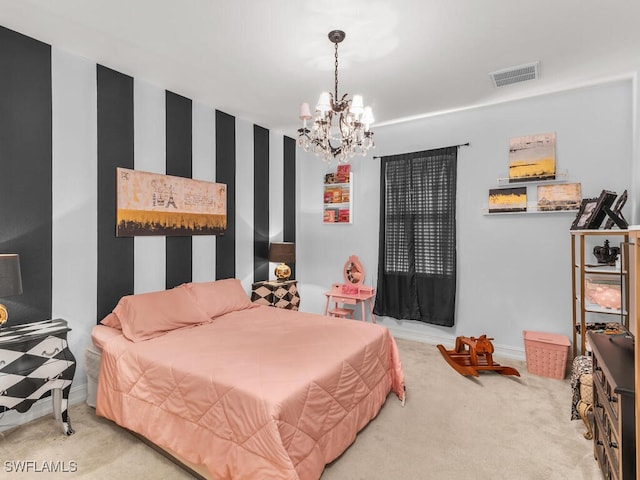 bedroom featuring a chandelier and carpet