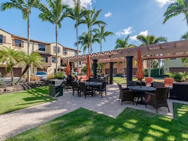 view of property's community featuring a yard, a pergola, a patio, and an outdoor hangout area