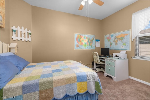 bedroom with ceiling fan, carpet floors, and multiple windows