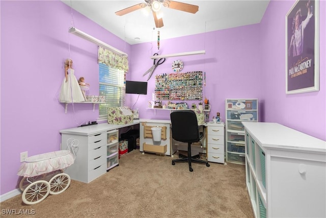 office area featuring ceiling fan and light carpet