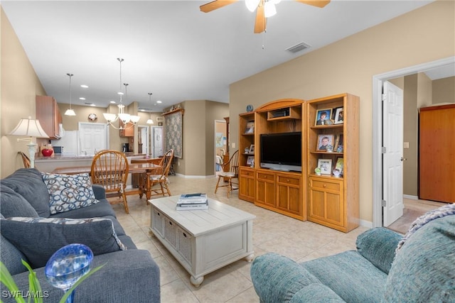 tiled living room featuring ceiling fan