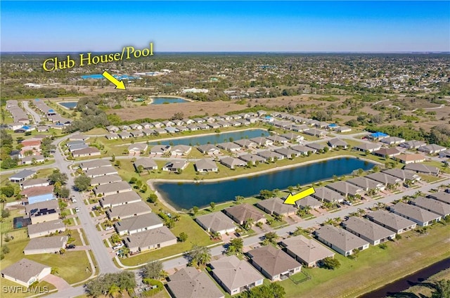 birds eye view of property with a water view