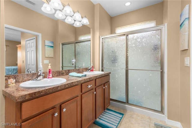 bathroom with vanity, tile patterned floors, and walk in shower