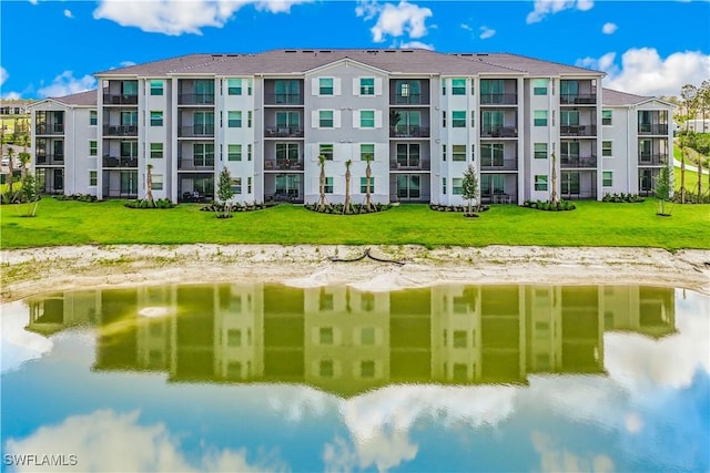 view of building exterior with a water view