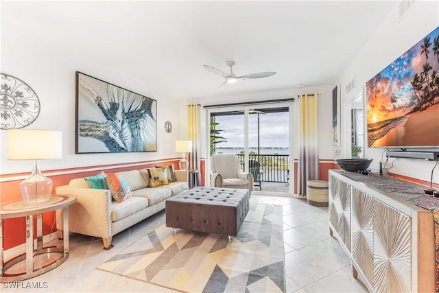 living room with ceiling fan and light tile patterned floors