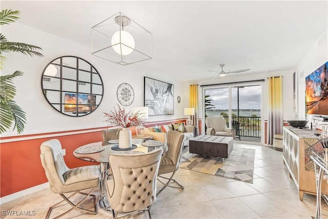 tiled dining space featuring ceiling fan