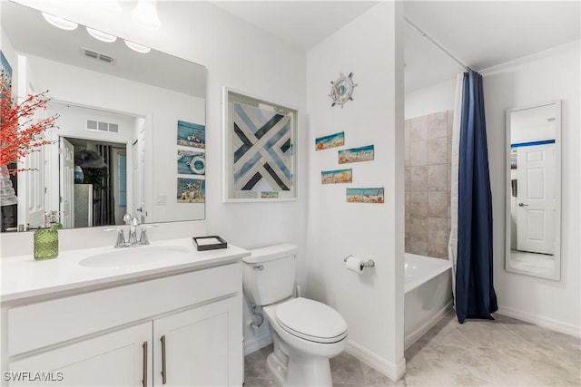 full bathroom featuring tile patterned flooring, shower / bath combo with shower curtain, vanity, and toilet